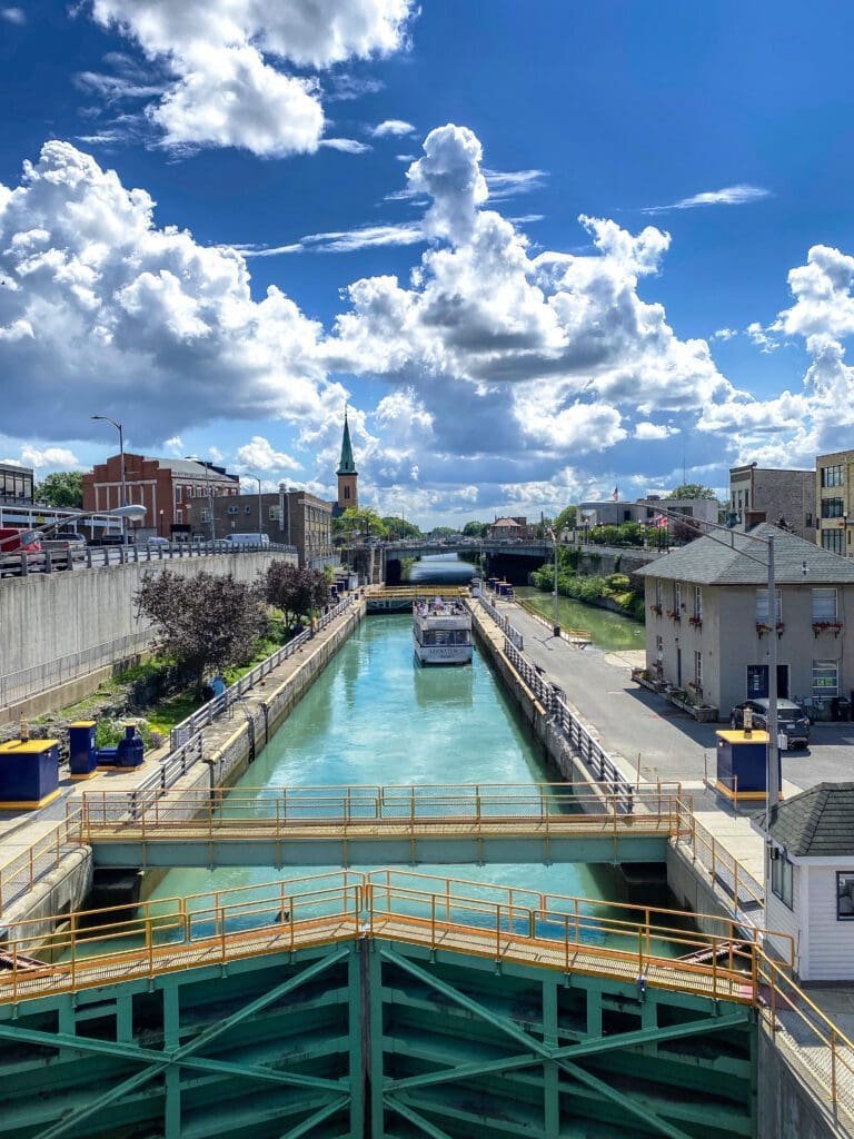 Erie Canal Lock E35 with boat locking in Lockport, New York. A canal cruise should be on everyone's travel bucket list