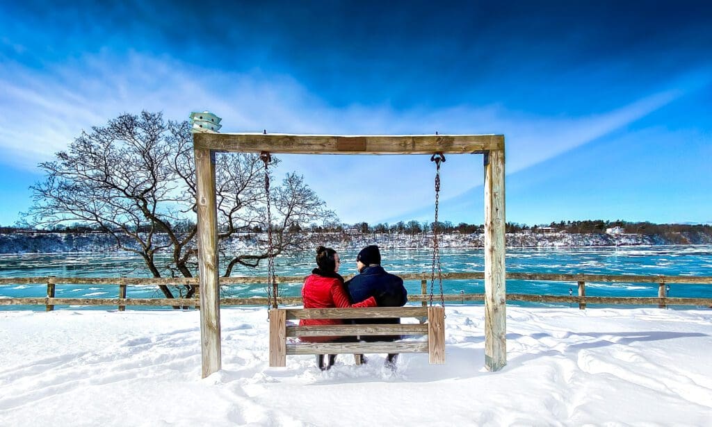 Winter snowy scene of Niagara River Sitting on a swing contemplating our New Years One Word choice