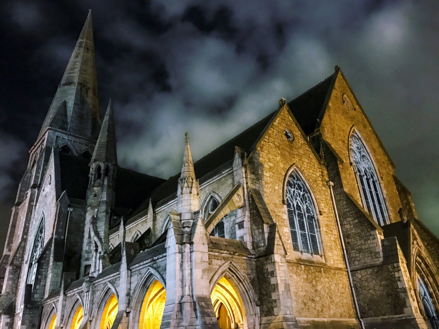 Exterior Night time photo of overcast skies and lit up Saint Andrews Church in Dublin, Ireland