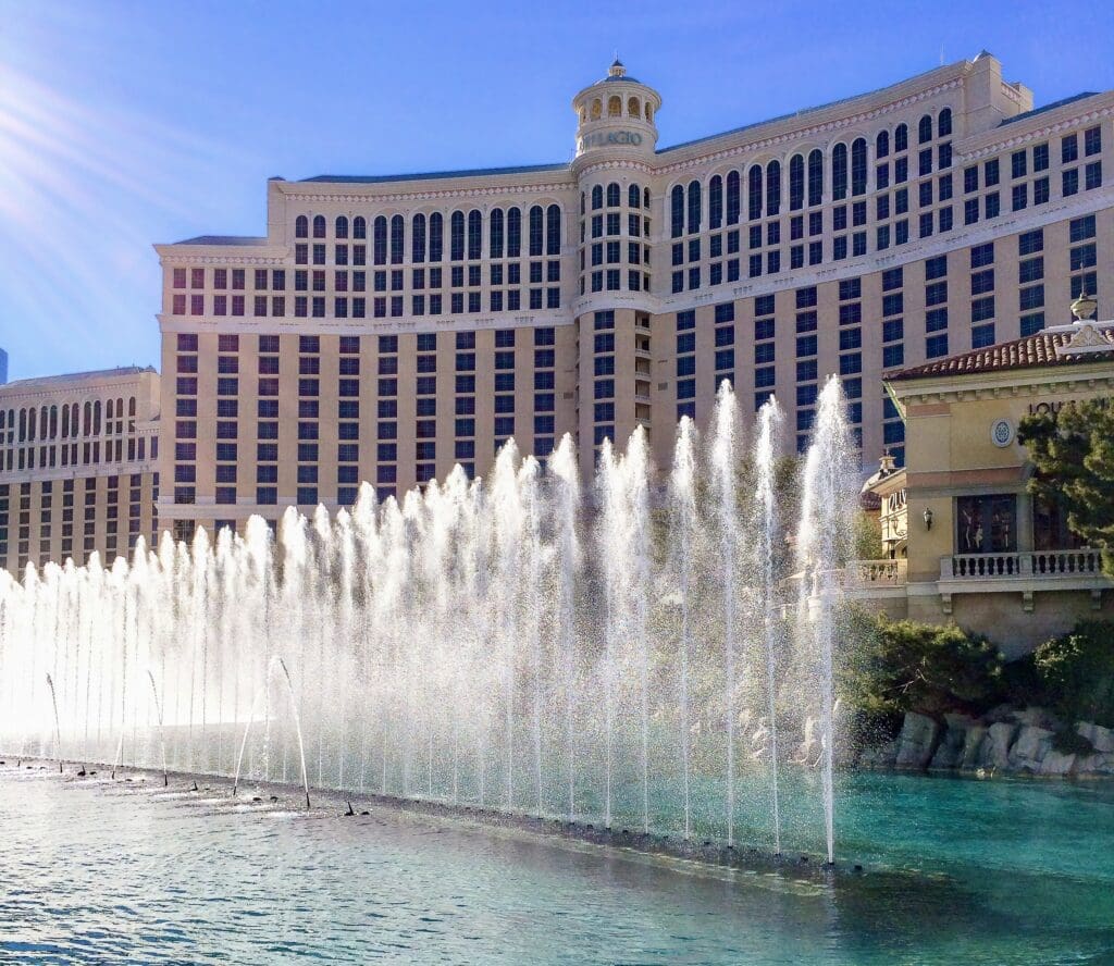 A fountain in front of a large building.