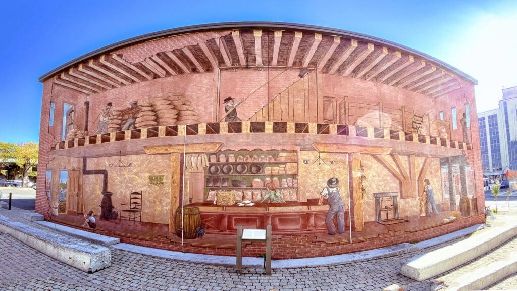 Wall mural of life in the 19th century general store commerce as found on the side wall of the Erie Canal Museum in Syracuse New York