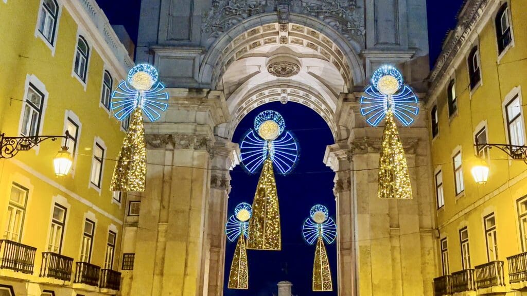 Festive Christmas lights in shape of angels over a pedestrian street on Rua Augusta in Lisbon, Portugal