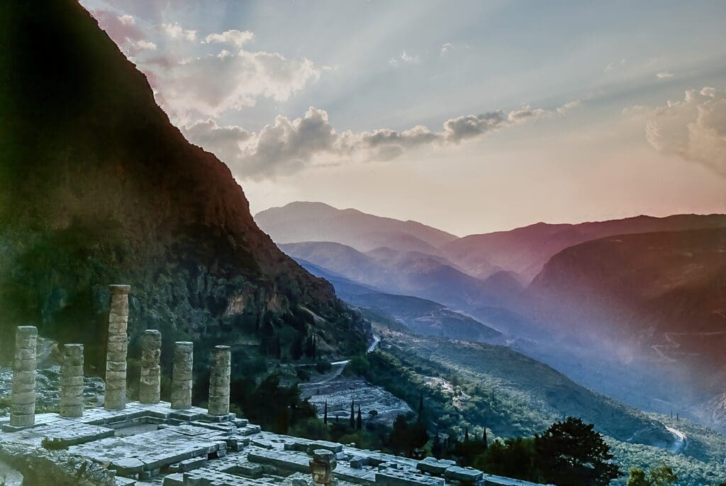 In Delphi the most famous landmark is the Temple of Apollo, viewed here during surnise as the sun streams down the valley below