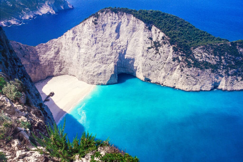 Beautiful azure seas and pristine white sand beach with the a ship wreck in a cove of the island of Zakynthos