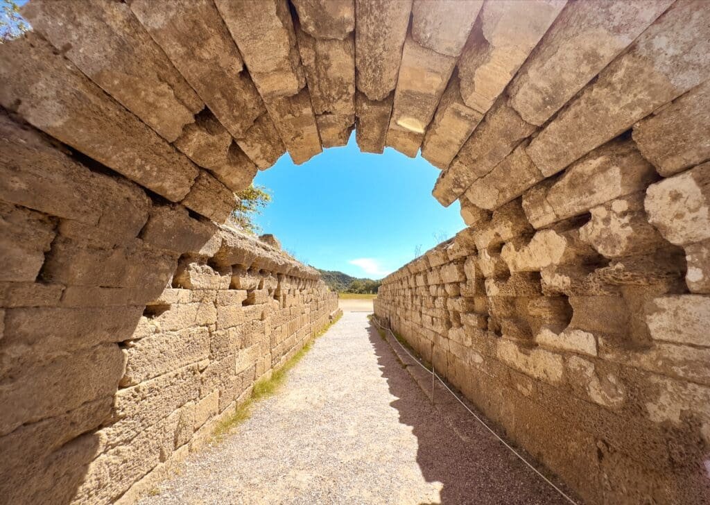 Stone arch marking the entrance to the stadium in ancient Olympia