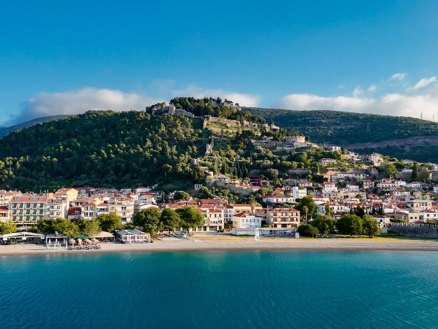 A view of the mountains and water from the ocean.