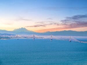 A view of the ocean with mountains in the background.