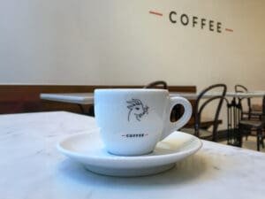A cup of coffee sitting on top of a saucer.