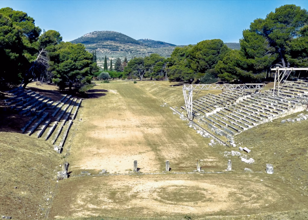 Stadium at Epidaurus with grass stadium and spectator marble seating on either side