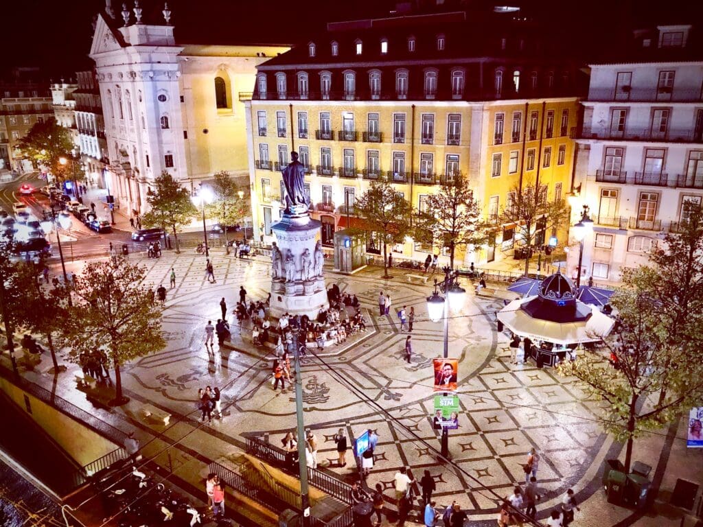 Lively atmosphere on a summer's night in Luís de Camões Square in Chiado