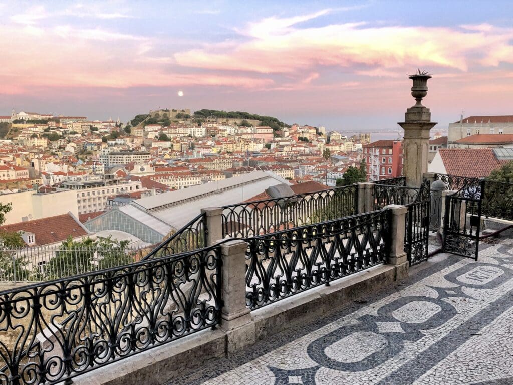 Sunset at a viewpoint in Lisbon, the Miradouro de São Pedro de Alcantara. Scenic spot in Lisbon, Portugal
