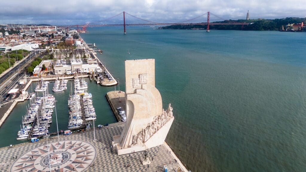 Aerial view of the Monument of the Discoveries and adjacent Marina with the Tagus River in the background