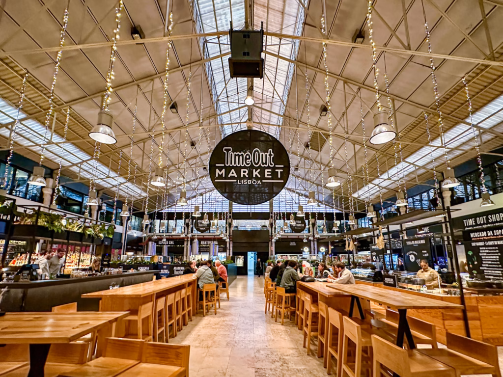 A large market with tables and chairs in it