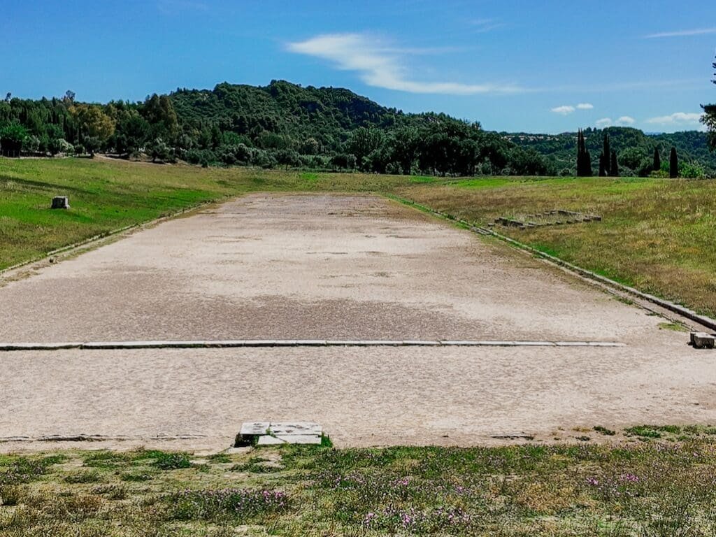 Archaeological site of the dirt foot race track at The Stadium of Ancient Olympia Greece. Photo by Paul Kostadimas © SpotlightSojourns.com