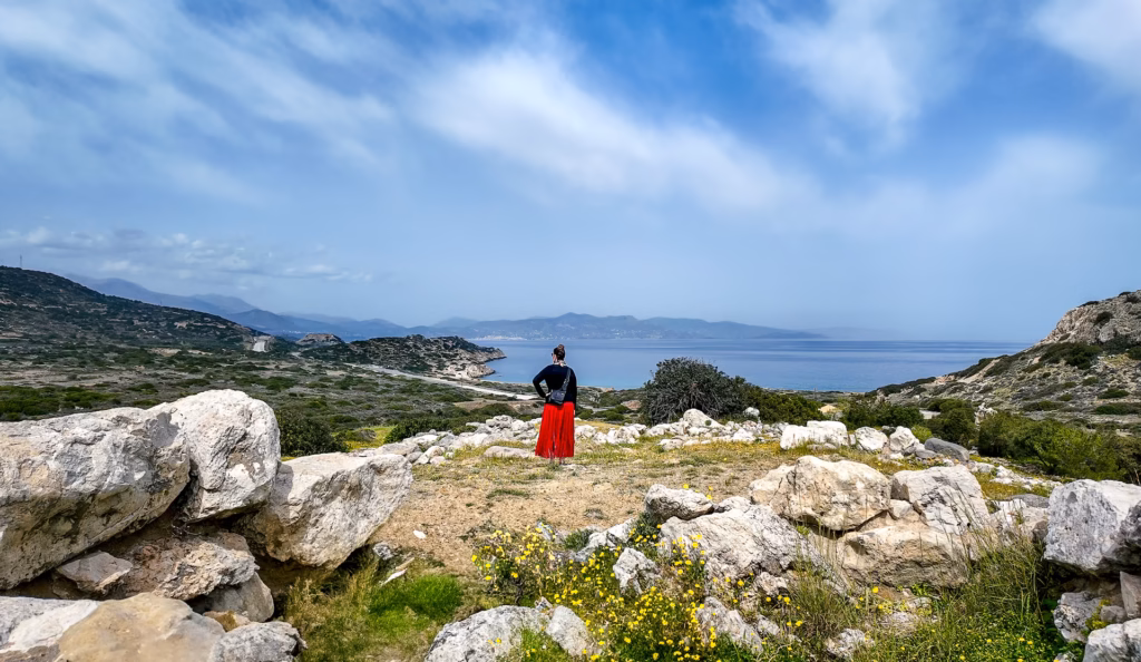 Standing on the acropolis of Gournia, surveying the site below and the Cretan Sea in the background
