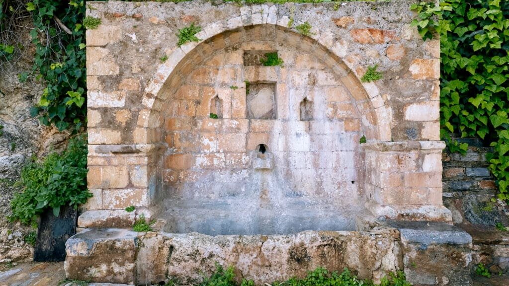 Historical fountain in the lakefront of Lake Voulismeni