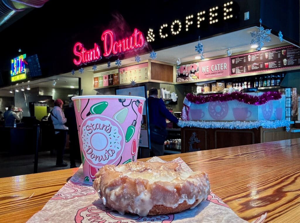 Old fashioned sour cream glazed donut with a cup of coffee 