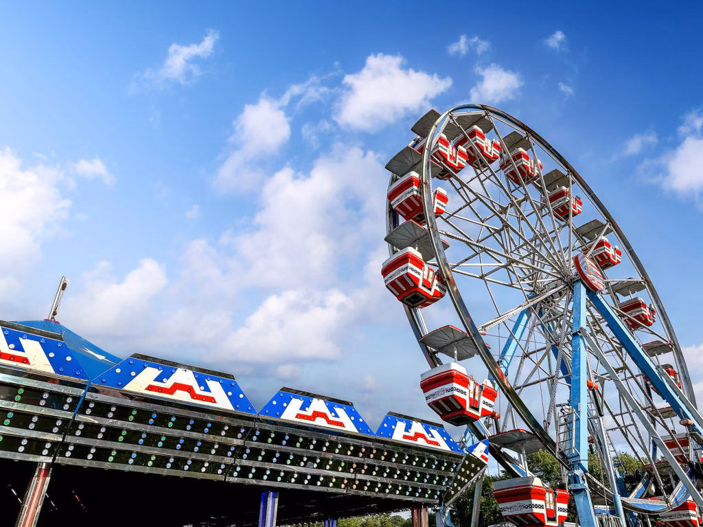 A ferris wheel with many rides on it. Lewiston New York festivals are famous attractions off the beaten path
