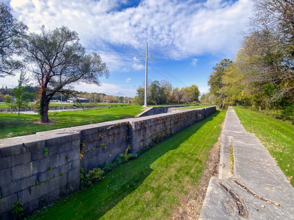 Large stone walls are the remains of historic Lock 60 of the historic Eric Canal, next to today's canalway. 