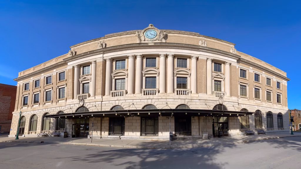 A large building with a clock on the front of it.