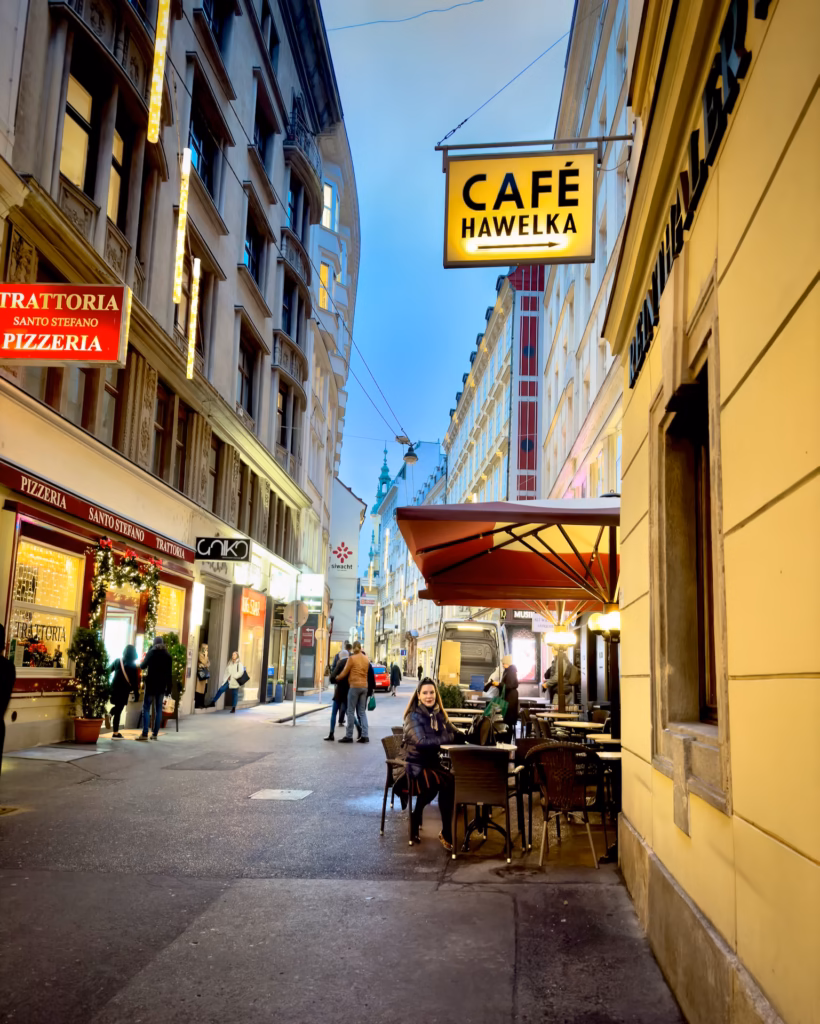 A cup of coffee and some tables in the street