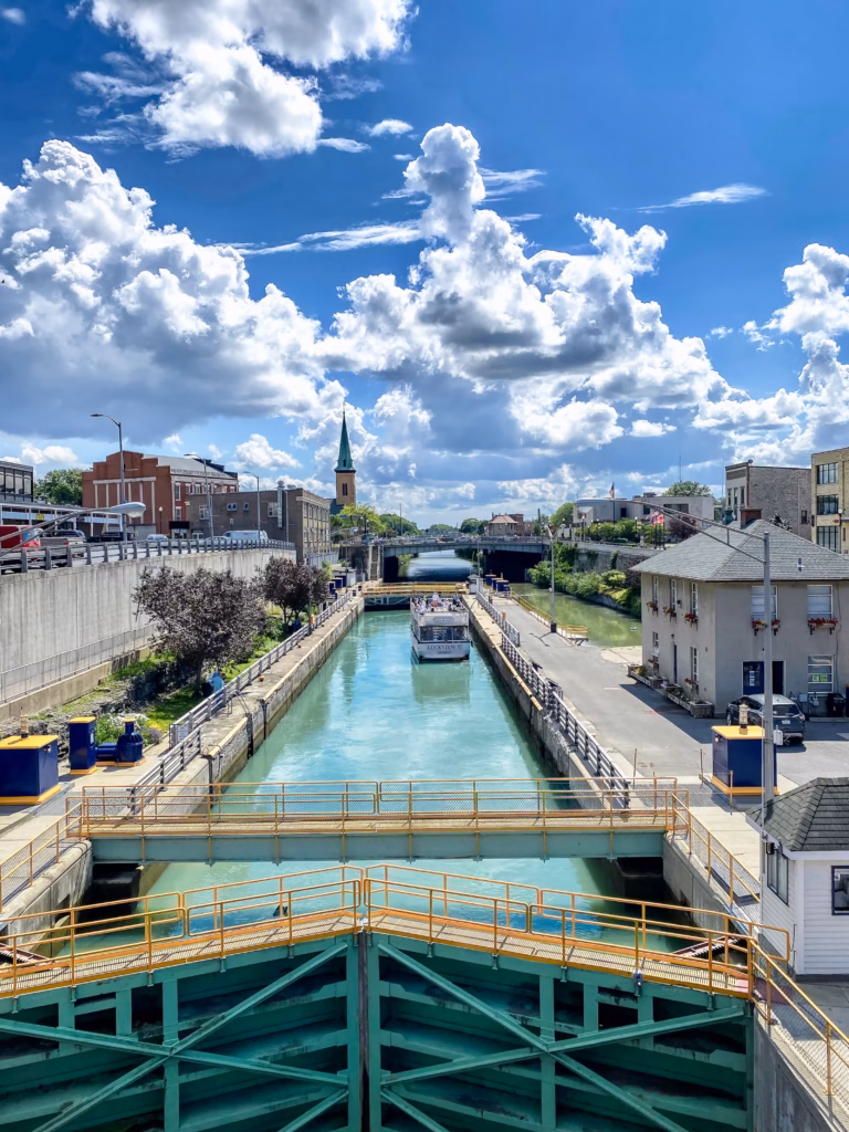 Erie Canal Lock E35 with boat locking in Lockport, New York. A canal cruise should be on everyone's travel bucket list