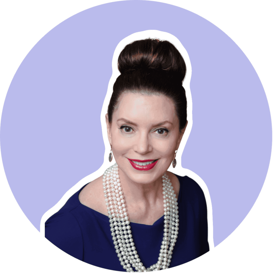 A woman with pearls in her hair and wearing a blue dress.